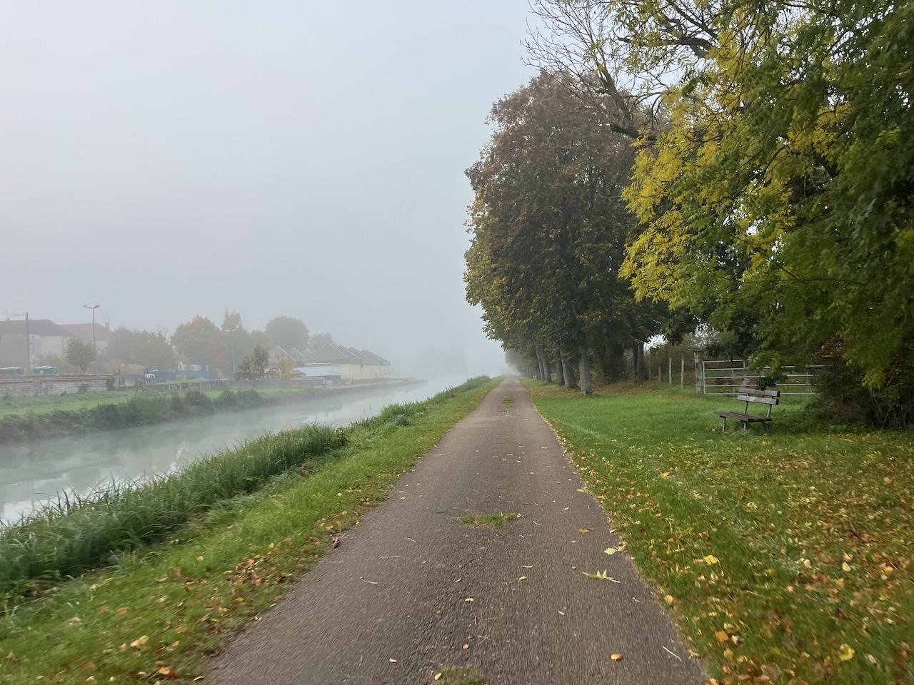 Towpath along a foggy canal
